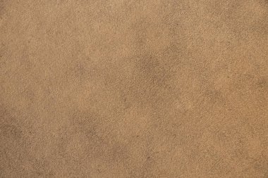 Arkaplan olarak açık bej düz kumaş, koltuk döşemesi