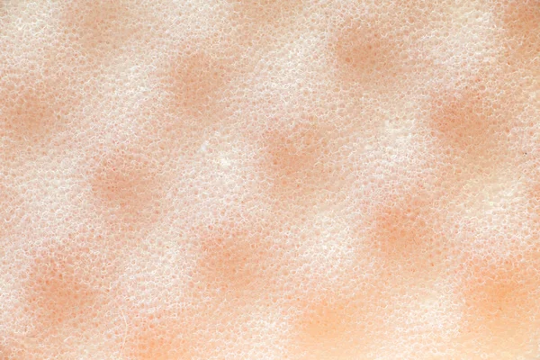 作为背景特写的浅橙色沐浴海绵 — 图库照片