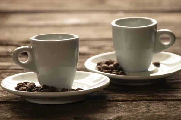 Two White Cups Saucer Grains Coffee Stand Wooden Table Morning — Stok Foto