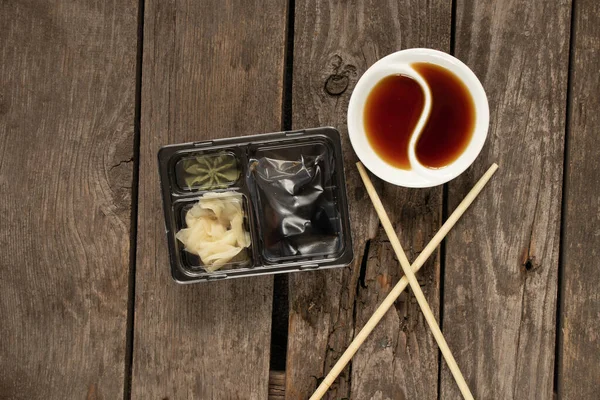 food container for delivery of sushi soy sauce and wasabi with food, delivery from sushi restaurant