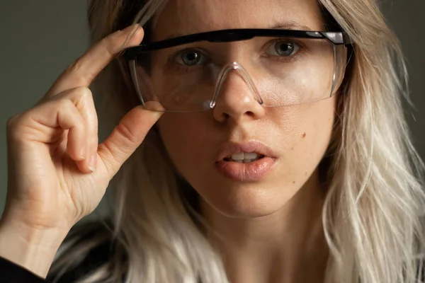 portrait of a young girl in medical goggles close-up