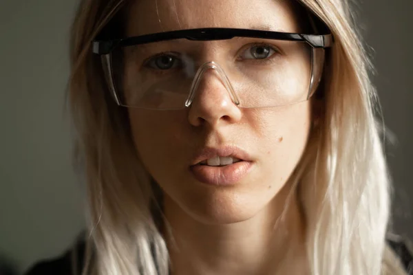 portrait of a young girl in medical goggles close-up