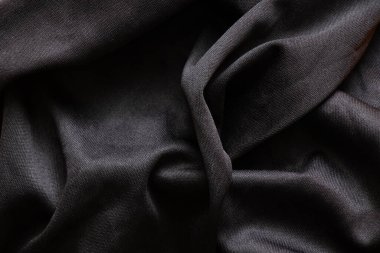 arkaplan yakın plan olarak siyah dalgalı akış kumaşı