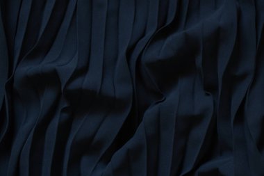 arkaplan yakın plan olarak siyah dalgalı akış kumaşı