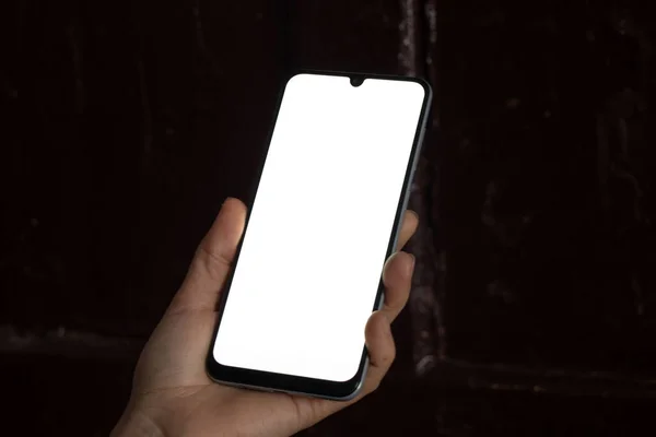 Teléfono Las Manos Una Joven Con Una Pantalla Blanca Para — Foto de Stock