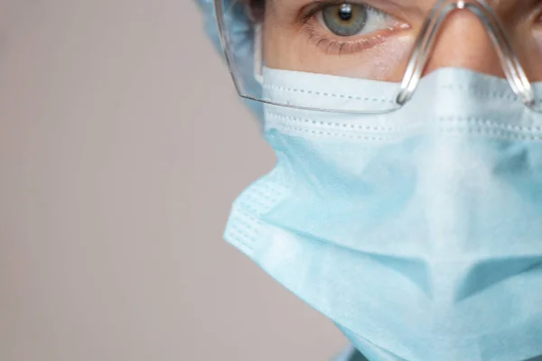 girl in a medical mask and glasses, medical worker overalls