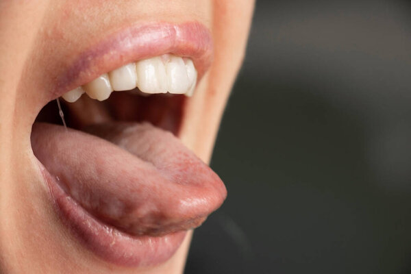 open mouth tongue lips of a young girl close up