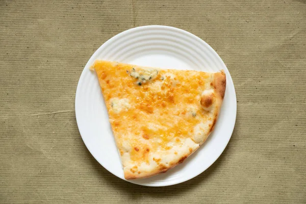 Piece Cheese Pizza Plate Lies Green Paper — Stock Photo, Image