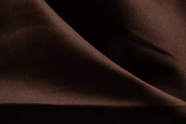 Arkaplan olarak koyu kahverengi kırışık kumaş