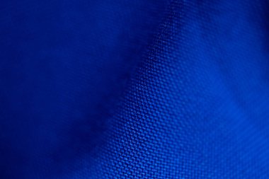 arka plan makro fotoğrafı olarak koyu mavi dalgalı kumaş