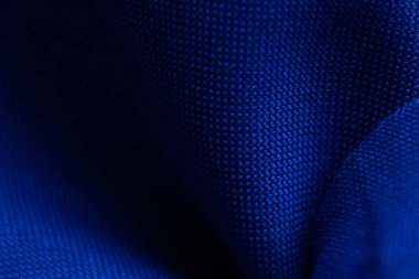 arka plan makro fotoğrafı olarak koyu mavi dalgalı kumaş