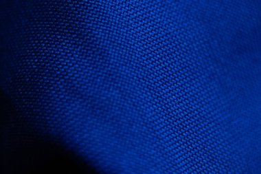 arka plan makro fotoğrafı olarak koyu mavi dalgalı kumaş