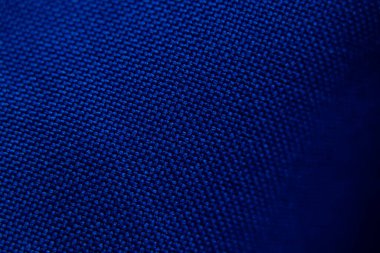 arka plan makro fotoğrafı olarak koyu mavi dalgalı kumaş