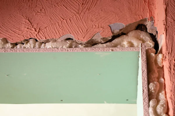 the wall is sheathed with moisture-resistant green plasterboard in the apartment, renovation work at home