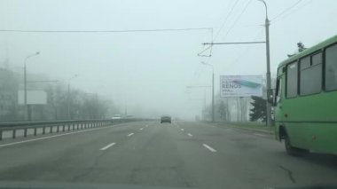 Ukraine Dnipro 05.04.2021 - filming a video from a car in the movement of city roads and urban residents, road traffic