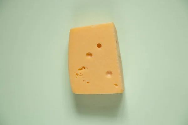 Piece Hard Cheese Colored Background Close — Stock Photo, Image