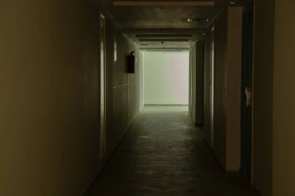 dark long corridor in the hotel, corridor in the dark