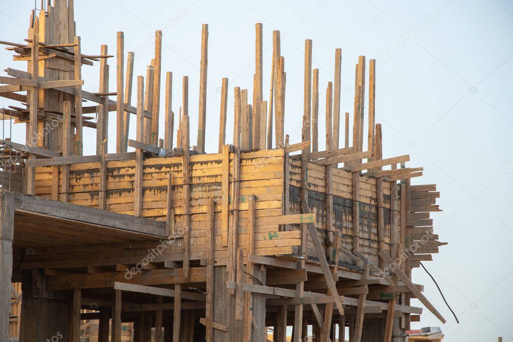 construction of a new hotel in the desert on a background of blue sky, construction of a building