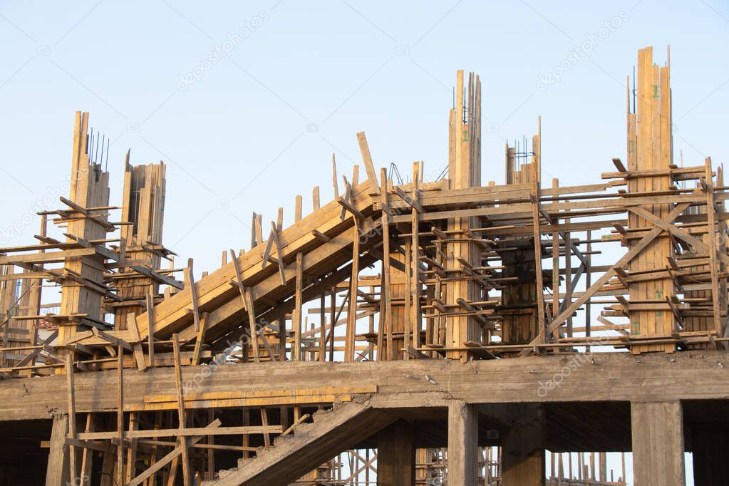 construction of a new hotel in the desert on a background of blue sky, construction of a building