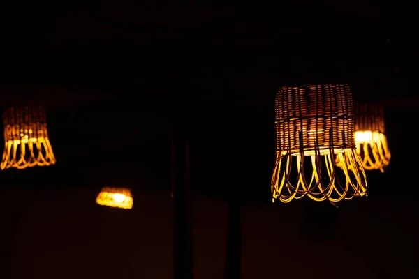 wicker straw street lamps glow in the dark, a lantern in the dark made of environmentally friendly materials