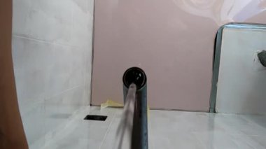 water flows from the tap in the kitchen sink, close-up of the kitchen sink