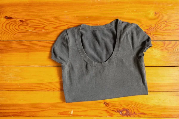 Gray Women Shirt Lies Wooden Table Close — Fotografia de Stock