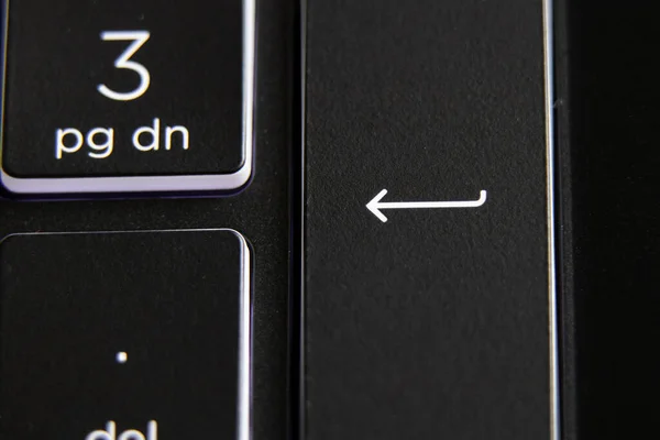 backlit gaming laptop keyboard as background, black keyboard