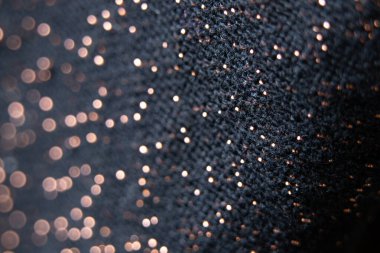 bulanık odaklı parlak lekeli siyah kumaş, arka plan için makro fotoğraf