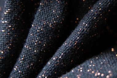 bulanık odaklı parlak lekeli siyah kumaş, arka plan için makro fotoğraf