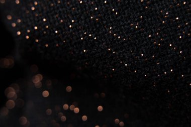 bulanık odaklı parlak lekeli siyah kumaş, arka plan için makro fotoğraf