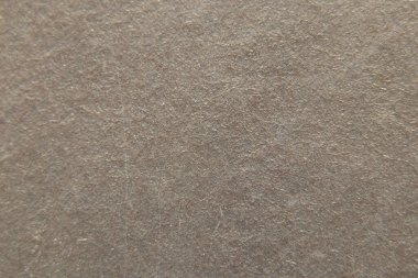 Arkaplan olarak gri parlak kağıt, yakın plan olarak gri