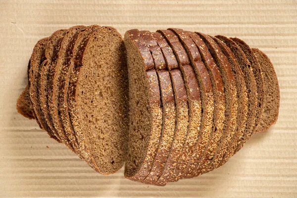 Loaf Black Bread Lies Brown Paper Black Bread — Stock Photo, Image