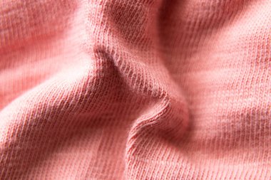 Pembe buruşuk kumaş arka plan makro fotoğrafı olarak, pembe arkaplan