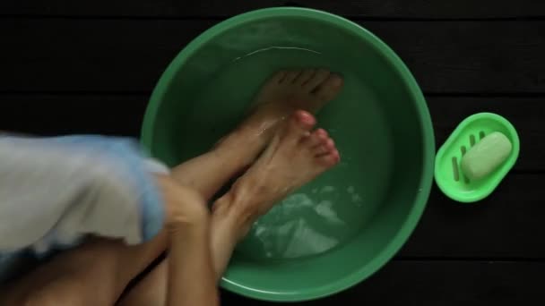 Girl Washes Her Feet Bowl Water Wooden Floor Home Foot — Stock Video