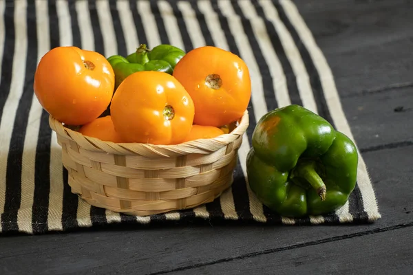 Yellow Tomatoes Selenium Bell Peppers Lie Plate Black Wooden Table — Stock Photo, Image