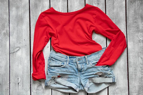 Red Jacket Denim Shorts Lie White Wooden Table Women Clothing — 图库照片
