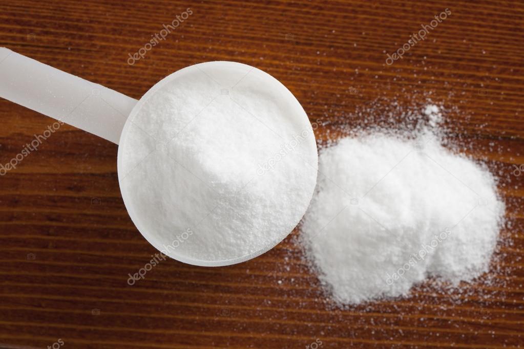 Creatine pyroglutamate in measure spoon Stock Photo by ©ogichobanov