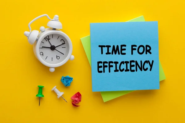 Time for efficiency concept with alarm clock.