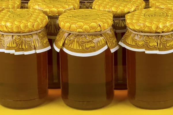 Composición con frascos de miel —  Fotos de Stock