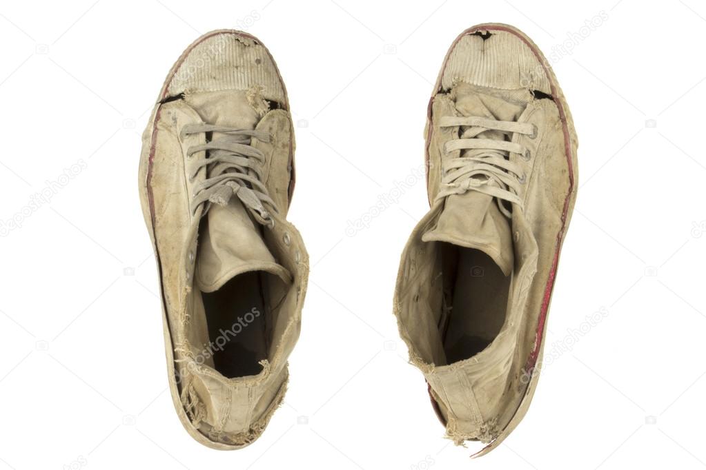 Old sports shoes isolated white