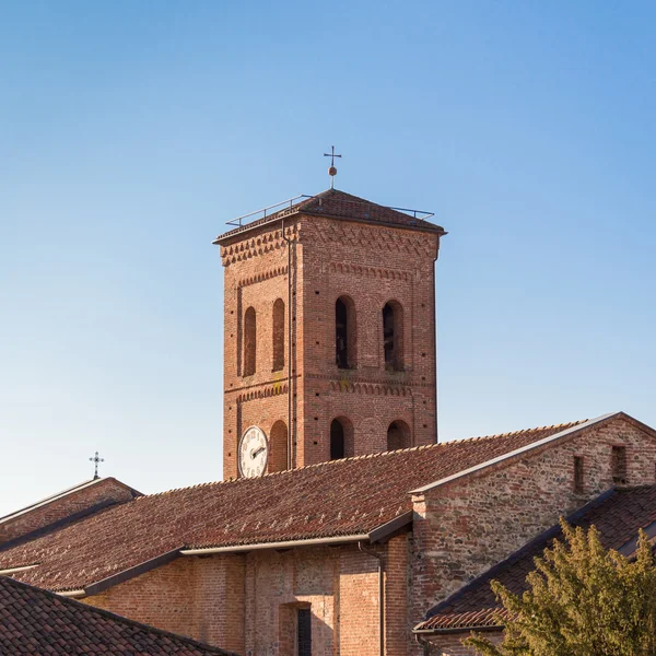 Bell tower of catholic european church made of bricks, with background of blue sky — Stock Photo, Image