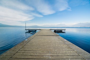 Wooden jetty with daylight at Viverone Lake, Italy clipart