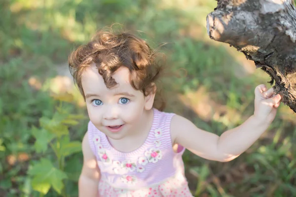 Little girl with big gray eyes Stock Image