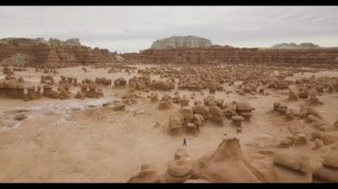 Fly over aerial shot of Goblin Valley State Park, Utah; Valley of Hoo doos