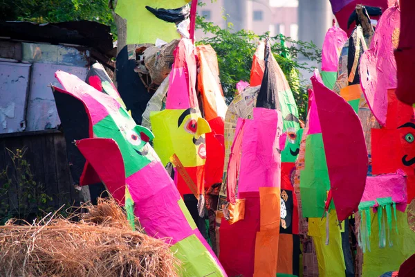 Zoomed in shot of colorful effigies of raavan the king of lanka made of paper mache by local artisans and sold on roadside for the hindu festival of dussera — Stock Photo, Image