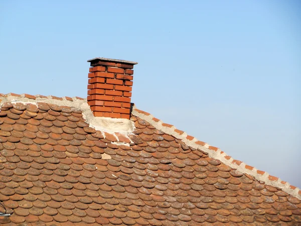 Roof with chimney Royalty Free Stock Photos
