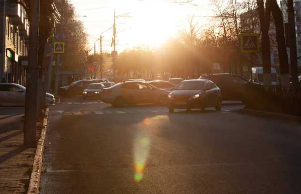 The movement of cars along the streets of Ryazan in the evening at sunset
