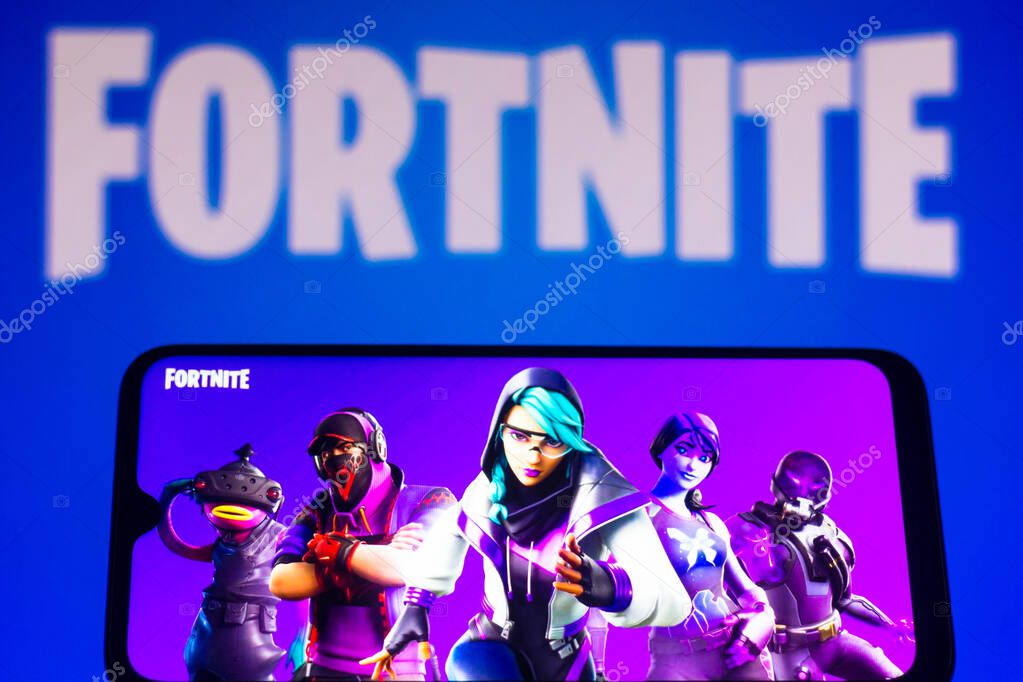 March 28, 2021, Brazil. In this photo illustration the Fortnite logo is seen on a smartphone and a pc screen