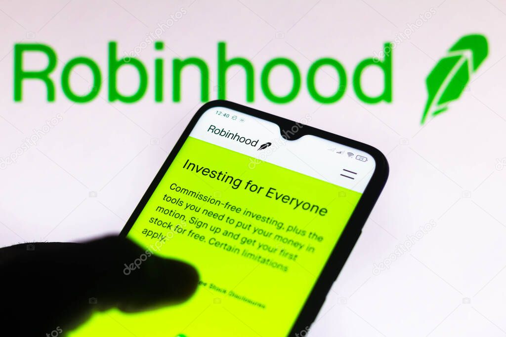 March 28, 2021, Brazil. In this photo illustration the Robinhood Markets logo is seen on a smartphone and a pc screen