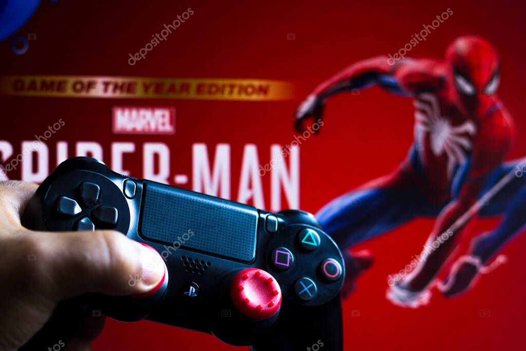 May 17, 2021, Brazil. In this photo illustration the controller for PlayStation (PS) and in the background the game logo Spider-Man
